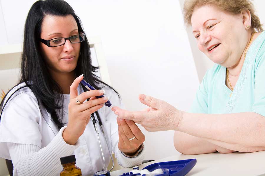 Doctor performing painless blood-glucose check